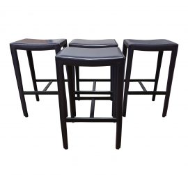 Set of Four Folio Purple Leather Backless Bar Stools. Original Price: $1,596
