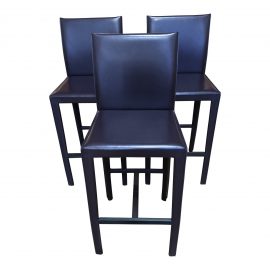 Set of Three Folio Back Purple Leather Bar Stools. Original Price: $1,587