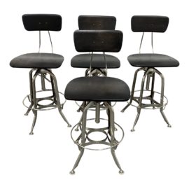 Restoration Hardware 1940's Toledo Adjustable Stools - Set of Four. Original Price: $1,580