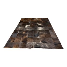 Design Within Reach Black Cowhide Patch Area Rug - 8′ × 9′10″. Original Price: $1,995