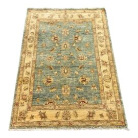 3ft 6in × 5ft 2in Turkish Teal With Tan Area Rug. Original Price: $1,000