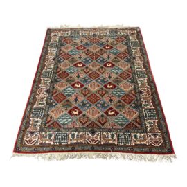 4ft 7in × 6ft 10in Persian Bakhtiari-Style Kheshti Garden Panel Wool Rug. Estimate Price: $12,400