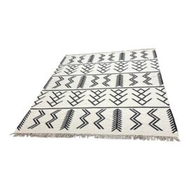 8ft 2in × 9ft 9in Four Hands Coulter Graphic Wool Area Rug. Estimate Price: $1,700